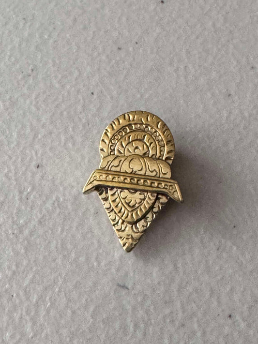 Traditional motif clip brooch